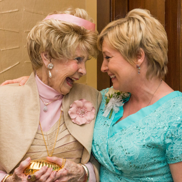 Judy and Lucille smiling at each other